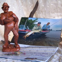 Red Mill, pecan figurine, fisherman